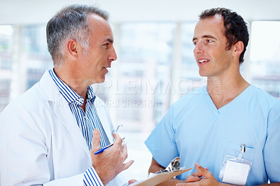 Doctor and resident discussing options